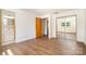 Bedroom offers hardwood floors and access to a bathroom, closet, and additional living space at 4250 N Center St, Hickory, NC 28601