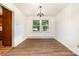 Bright dining room features beautiful hardwood floors, a chandelier, and plenty of natural light at 4250 N Center St, Hickory, NC 28601