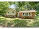 Charming two-story home with a combination of brick and siding exterior and well-manicured lawn at 4250 N Center St, Hickory, NC 28601
