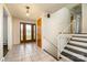 Inviting foyer with tiled floors, staircase, and a decorative glass front door at 4250 N Center St, Hickory, NC 28601