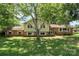 Charming home with a mix of brick and siding, featuring mature trees in the front yard at 4250 N Center St, Hickory, NC 28601