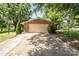 Detached garage with a large driveway and well-maintained landscaping with mature trees at 4250 N Center St, Hickory, NC 28601