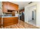 Open kitchen features stainless appliances, wood cabinets, a breakfast bar, and plenty of natural light at 4250 N Center St, Hickory, NC 28601