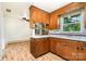 Eat-in kitchen features plenty of wood cabinets, and views into another living space at 4250 N Center St, Hickory, NC 28601