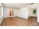 Open-concept living room boasts wood floors and seamless flow to the dining area at 4250 N Center St, Hickory, NC 28601