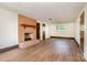 Large living room with brick fireplace and wood-look floors; ready for customization at 4250 N Center St, Hickory, NC 28601