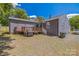 View of the backyard with a deck, a grill, and gravel at 432 4Th Street Sw Pl, Hickory, NC 28602