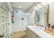 Modern bathroom with glass-enclosed shower, marble countertop vanity, and neutral color palette at 432 4Th Street Sw Pl, Hickory, NC 28602