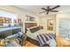Bedroom showcasing hardwood floors, desk, and a ceiling fan at 432 4Th Street Sw Pl, Hickory, NC 28602