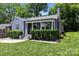 Charming brick home featuring a cozy front porch with well-manicured landscaping and inviting curb appeal at 432 4Th Street Sw Pl, Hickory, NC 28602