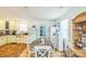 Charming eat-in kitchen with a retro refrigerator, ample counter space, and hardwood floors at 432 4Th Street Sw Pl, Hickory, NC 28602
