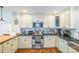 Updated kitchen featuring stainless steel appliances, light-colored cabinetry and hardwood floors at 432 4Th Street Sw Pl, Hickory, NC 28602