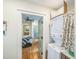 Laundry room leading to bedroom with hardwood floors and vanity at 432 4Th Street Sw Pl, Hickory, NC 28602