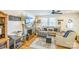 Comfortable living room featuring a decorative fireplace, hardwood floors, and plenty of natural light at 432 4Th Street Sw Pl, Hickory, NC 28602