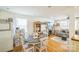 Open-concept living space with hardwood floors, connecting the kitchen, dining area, and living room seamlessly at 432 4Th Street Sw Pl, Hickory, NC 28602