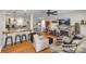 Open-concept living space featuring hardwood floors, a breakfast bar, and a decorative fireplace at 432 4Th Street Sw Pl, Hickory, NC 28602