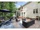 Entertain on this spacious deck featuring an outdoor kitchen and comfortable seating with views of the backyard at 4716 Heatherton Pl, Charlotte, NC 28270