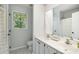Bright bathroom featuring a double vanity, toilet, and natural light at 4716 Heatherton Pl, Charlotte, NC 28270