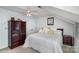 Bedroom featuring a ceiling fan, neutral walls, and dark furniture at 4716 Heatherton Pl, Charlotte, NC 28270