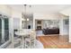 Bright breakfast nook with hardwood floors, view of living room with fireplace at 4716 Heatherton Pl, Charlotte, NC 28270