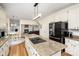 Bright kitchen features granite countertops, island cooktop, and black appliances at 4716 Heatherton Pl, Charlotte, NC 28270