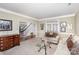 Inviting living room featuring a comfortable sofa, glass coffee table, and french doors at 4716 Heatherton Pl, Charlotte, NC 28270