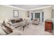 Comfortable living room with a bay window, neutral-toned furniture, and plush carpeting at 4716 Heatherton Pl, Charlotte, NC 28270