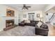Comfortable living room with brick fireplace and a large sectional sofa at 4716 Heatherton Pl, Charlotte, NC 28270