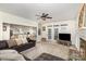 Cozy living room open to the kitchen features fireplace and outdoor access at 4716 Heatherton Pl, Charlotte, NC 28270