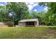 Well-kept backyard showcases a screened-in porch, perfect for outdoor relaxation and entertaining at 5233 Great Wagon Rd, Charlotte, NC 28215