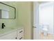 Updated bathroom featuring modern sink, new vanity, and toilet at 5233 Great Wagon Rd, Charlotte, NC 28215