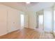 A bright bedroom with hardwood floors and white walls at 5233 Great Wagon Rd, Charlotte, NC 28215