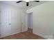 Cozy bedroom with fresh paint and new wood-look flooring at 5233 Great Wagon Rd, Charlotte, NC 28215