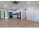 Bright, updated kitchen featuring modern appliances, white cabinets, and wood-look flooring at 5233 Great Wagon Rd, Charlotte, NC 28215