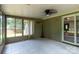 A sunroom with tile flooring and a ceiling fan at 5233 Great Wagon Rd, Charlotte, NC 28215