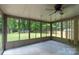 Enclosed sunroom with lots of windows and views of the back yard at 5233 Great Wagon Rd, Charlotte, NC 28215