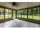Enclosed sunroom with lots of windows and views of the back yard at 5233 Great Wagon Rd, Charlotte, NC 28215