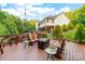 A spacious back deck features a gas fire pit, and comfortable Adirondack seating perfect for relaxing outdoors at 560 Blue Sky Dr, Dallas, NC 28034