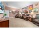 Finished basement with multiple leather recliners, entertainment center, and comic book themed wall art at 560 Blue Sky Dr, Dallas, NC 28034