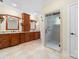 Bathroom features double sinks with granite countertop, wooden cabinets, and frameless glass shower enclosure at 560 Blue Sky Dr, Dallas, NC 28034