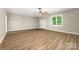Large open bonus room featuring laminate floors and abundant natural light at 560 Blue Sky Dr, Dallas, NC 28034