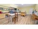 Well-lit craft room with multiple work surfaces, shelving and wood-look flooring at 560 Blue Sky Dr, Dallas, NC 28034