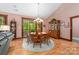 Cozy dining room with hardwood floors, wooden dining set, china cabinet, and sliding glass doors to the outside at 560 Blue Sky Dr, Dallas, NC 28034