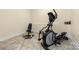 Basement exercise room with workout bench, free weights and elliptical machine at 560 Blue Sky Dr, Dallas, NC 28034
