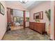 Charming foyer with stone tile flooring, wooden buffet, and an open view of the living room with a stone fireplace at 560 Blue Sky Dr, Dallas, NC 28034