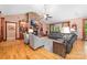 Cozy living room with a stone fireplace, built-in shelving, hardwood floors, and comfortable seating arrangement at 560 Blue Sky Dr, Dallas, NC 28034