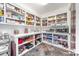 Well-organized pantry with extensive shelving, countertop space, and room for small appliances to maximize storage at 560 Blue Sky Dr, Dallas, NC 28034