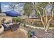 Charming backyard featuring brick patio, string lights, brick wall, and an outdoor seating area at 5721 Ballinard Ln, Charlotte, NC 28277