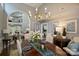 Spacious dining room featuring hardwood floors, chandelier, and open access to the living areas at 5721 Ballinard Ln, Charlotte, NC 28277
