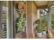 Inviting entryway with a glass front door, stylish wreaths, and potted plants at 5721 Ballinard Ln, Charlotte, NC 28277